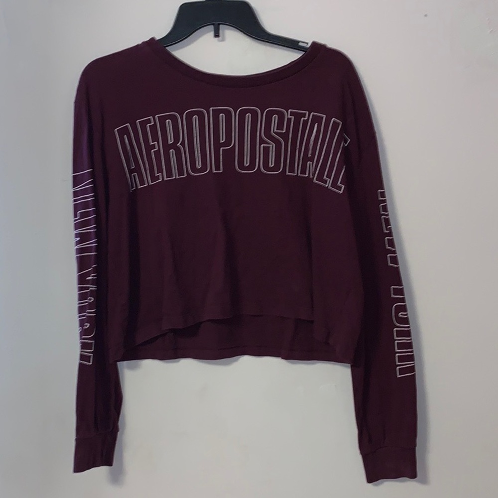 Cropped long sleeve shirt. Lightly worn